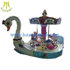 الصين Hansel large electronic fiberglass swan carousel ride for kids المزود